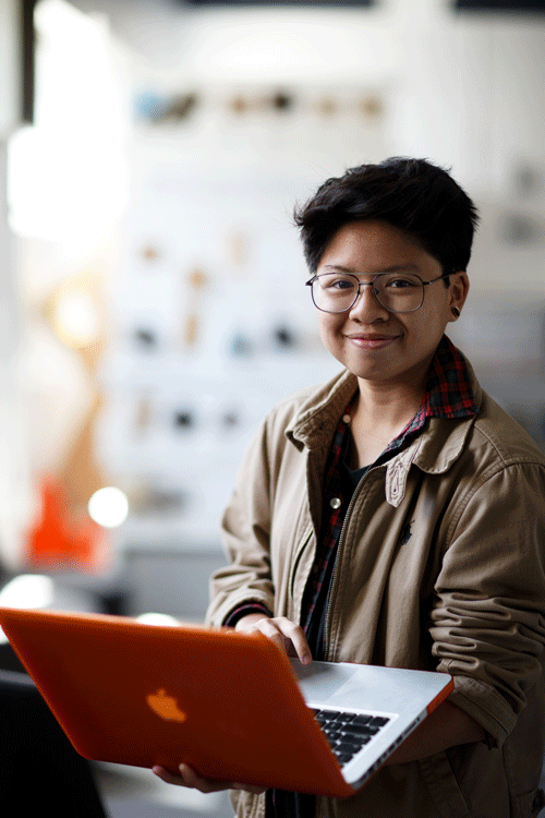 Math student with orange laptop